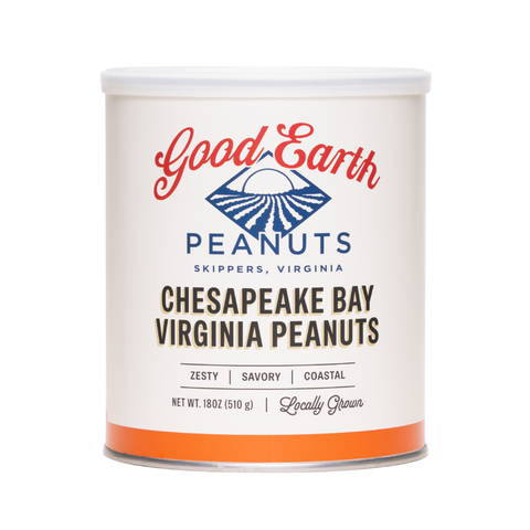 A white cylindrical canister of Good Earth Peanuts Chesapeake Bay Virginia Peanuts, featuring a white label with red and blue branding and an orange band at the bottom, set against a plain white background.