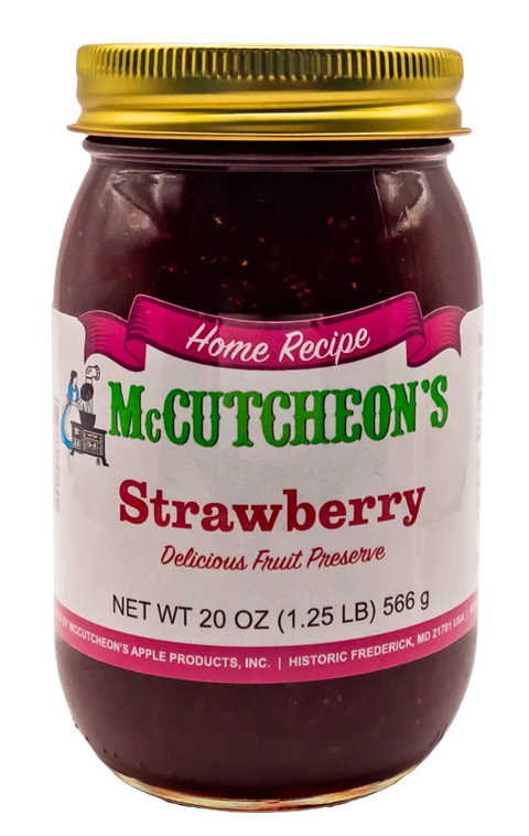 A 20 oz glass jar of McCutcheon's Strawberry Delicious Fruit Preserve with a gold metal lid and a white label featuring green and pink text.