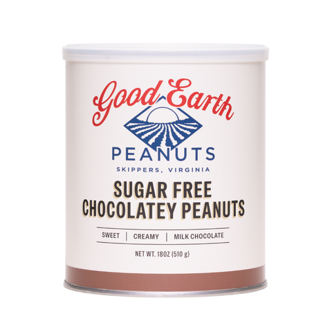 A cylindrical metal canister of Good Earth Sugar Free Chocolatey Peanuts on a plain white background. The label is cream-colored with red and blue branding, and a brown band at the bottom representing the chocolate flavor.