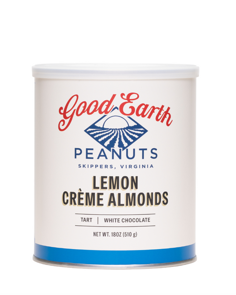 A white cylindrical canister of Good Earth Peanuts Lemon Crème Almonds, featuring a white lid and a label with red and blue branding on a clean white background.