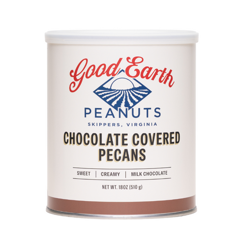 A 18 oz can of Good Earth Chocolate Covered Pecans on a solid white background. The can features a white label with red and blue branding and text indicating 'Chocolate Covered Pecans' and 'Sweet, Creamy, Milk Chocolate'.