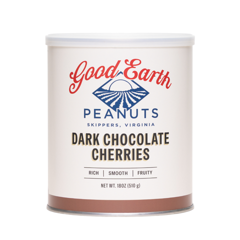 A 18 oz canister of Good Earth Peanuts Dark Chocolate Cherries on a clean white background. The canister has a white label with red and blue branding, and a brown band at the bottom representing the chocolate cherries flavor.