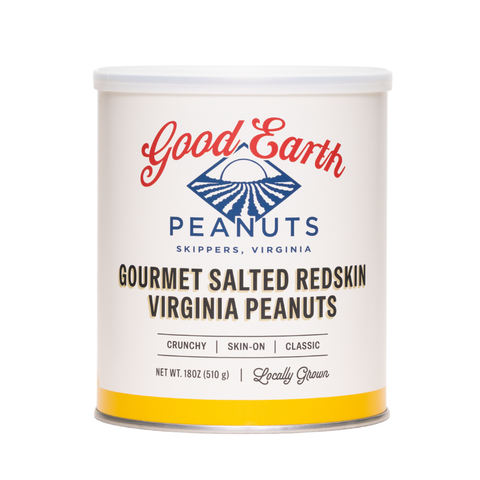 A white cylindrical canister of Good Earth Peanuts Gourmet Salted Redskin Virginia Peanuts, featuring a white label with red and blue branding and a yellow band at the bottom, set against a plain white background.